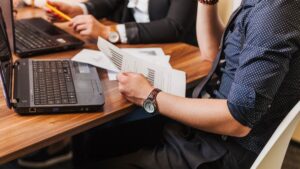 Describe how total job benefits and total employee compensation differ.